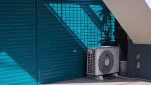 outdoor compressor unit installed on a residential pad - ductless hvac benefits for homeowners
